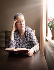 Old woman with big bpook