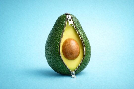Creative Avocado with Zipper on Pastel Blue Background