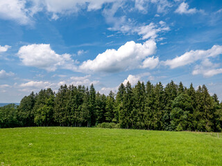 Beautiful pre-Alpine landscape with blue skies in the district of Miesbach in Bavaria.