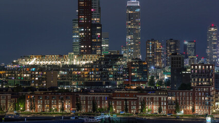 Aerial day to night timelapse of Katendrecht peninsula and Maashaven harbour in Rotterdam, The Netherlands.