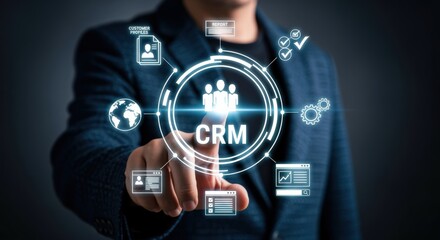 Customer relationship management concept. Businessman touching virtual interface screen with CRM icons, business strategy development