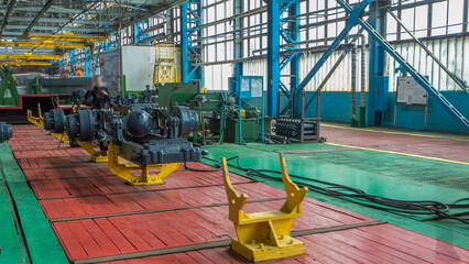 Conveyor assembly stage the body of tractor at big industrial factory timelapse