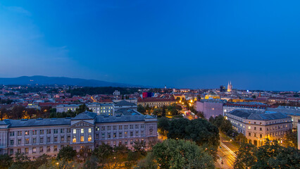 Panorama of the city center day to night timelapse with intersection in front of national theater and museum in Zagreb, Croatia.