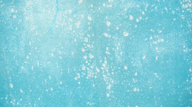 Blue grunge concrete background with cracked paint and saltpeter texture.