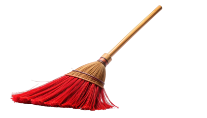Angled broom with red bristles and wooden handle against a black background