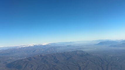 Colli Albani mountains aerial view blue sky misty landscape from airplane window over Rome Italy, volcanic hills natural terrain concept of geography, aviation, nature