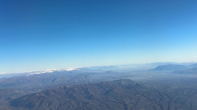Colli Albani mountains aerial view blue sky misty landscape from airplane window over Rome Italy, volcanic hills natural terrain concept of geography, aviation, nature