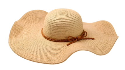 Straw sun hat with brown ribbon on white background in soft natural lighting for summer fashion and outdoor activities