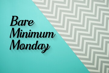 Bare Minimum Monday text written on blue background