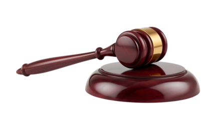 Gavel on sound block in dark wood with gold band in formal courtroom setting for law and justice themes