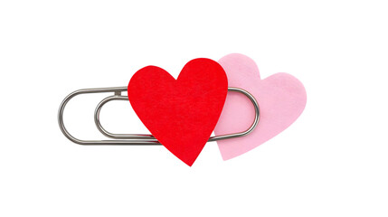 Paperclip with red and pink hearts attached in soft minimalist style with pastel colors and clean background for valentines day greeting card