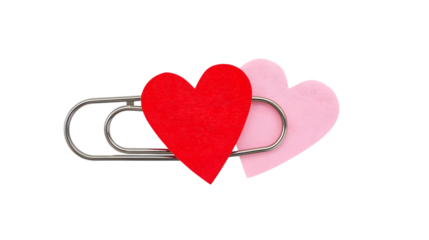 Paperclip with red and pink hearts attached in soft minimalist style with pastel colors and clean background for valentines day greeting card