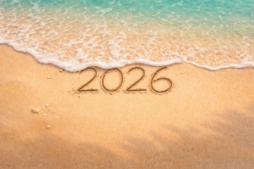 2026 Written in Sand on Beach with Gentle Sea Wave &ndash; Aerial New Year Concept