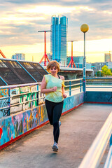 Young woman running in the city