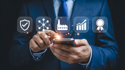 Man in suit touching smartphone displaying business strategy icons for growth and quality.png
