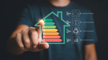 Man interacts with a digital house interface showing energy efficiency rating and icons.png