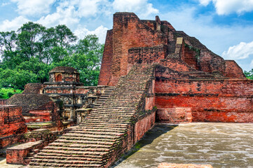 Nalanda University ruins in Bihar reveal a vast ancient learning center, founded in the 5th century CE, famed for monasteries, libraries, and global Buddhist scholars.