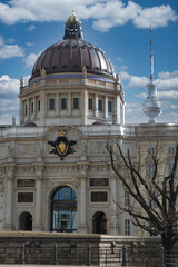 Humboldt Forum Dome and Berlin TV Tower - Detailed close-up of the reconstructed Humboldt Forum dome juxtaposed with the modern Fernsehturm against a blue, cloudy sky in Berlin.