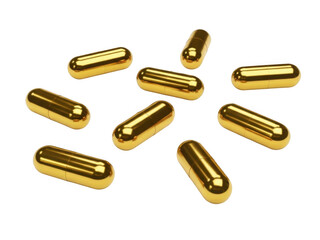 Scattered golden capsules isolated on transparent background