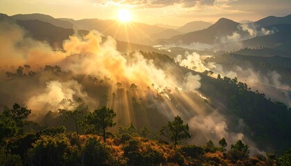 Stunning aerial view of a mountain range at sunrise, with golden sunbeams cutting through the smoke from a spreading wildfire. A dramatic scene of natural disaster and environmental destruction.