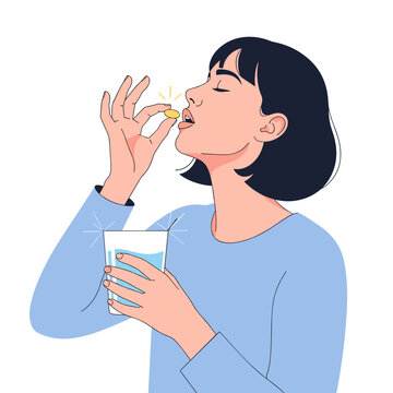 Woman taking omega-3 capsule with water in modern setting  