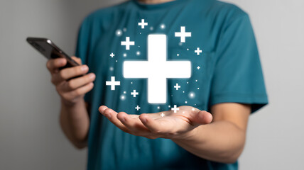 Person holding a smartphone showing a large glowing plus sign surrounded by smaller crosses.png