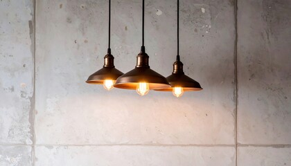 Three Pendant Lights Against a Concrete Wall.
