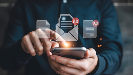 Person uses a smartphone to interact with glowing advertisement icons and message notifications, representing digital advertising.png