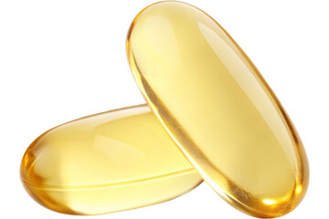 Golden capsules on black background for health and wellness
