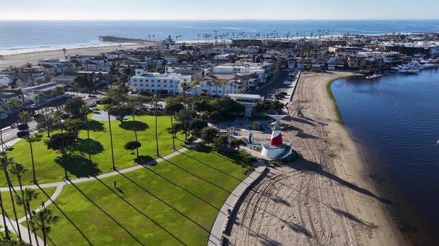 Aerial footage along the coastline and Newport Bay at Marina Park in Newport Beach California USA