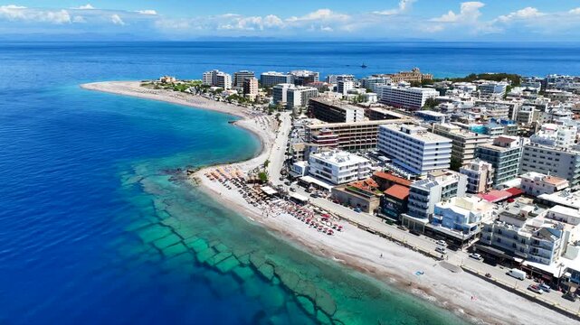 Aerial drone cinematic video of famous main sandy beaches of Rhodes island west coast called Akti Miaouli and Akti Kanari famous for luxury hotels and nice seaside restaurants, Dodecanese, Greece