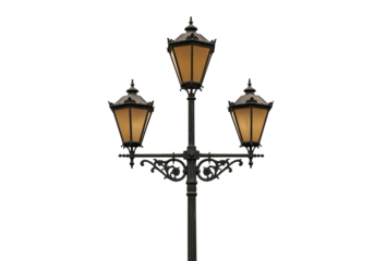 Elegant vintage street lamp glows warmly at dusk