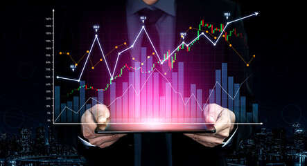 A businessman presents a digital tablet displaying colorful financial charts and graphs, representing investment growth and data analysis in a modern corporate environment. Scalp