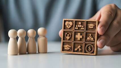 Decision making and organization concept: hand placing a block among icon blocks
