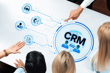 Visual representation of a modern CRM system with a focus on teamwork, analytics, and business strategy in a collaborative work environment. Trope
