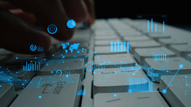 A close-up shot of a computer keyboard with an overlay of digital graphs and charts, symbolizing the integration of technology and data analysis in contemporary business practices. Xenic - Powered by Adobe