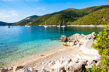 View of beautiful Mikros Gialos beach and calm turquoise sea water, Lefkada island, Greece