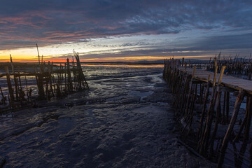 Carrasqueira palafitic port wooden pier at sunset