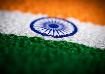 Macro view of embroidered Indian flag fabric texture With Ashoka Chakra Indian Flag For Celebration
