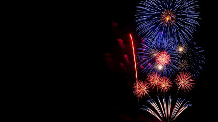Vibrant fireworks exploding in the night sky on independence day