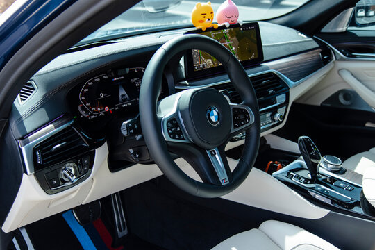 March 31, 2021, Seoul, South Korea - Interior view of a BMW M550i with dashboard, steering wheel, and navigation screen
