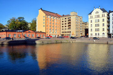 Fototapeta premium Pohjoisranta is located in center and runs along northern harbor Helsinki Finland. On waterfront there are houses built in different architectural styles in different historical periods