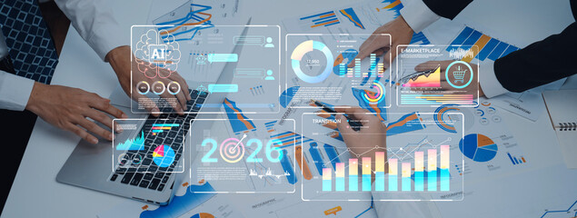 Professionals collaborate on data analysis with visual graphs and charts in a modern office. A laptop displays digital metrics aiding in strategic decision-making. Trope