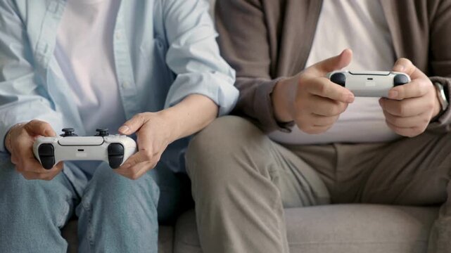 People Playing Video Games Together, Competitive and Casual Gaming Scene, Friends Enjoying Digital Entertainment, Modern Lifestyle and Technology Concept, High Quality Stock Footage