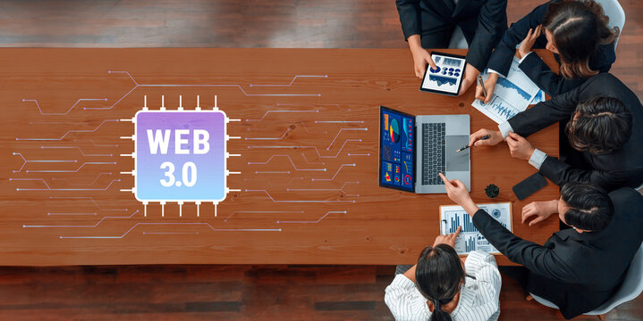 Modern business team engages in a collaborative session focused on Web 3.0 strategies. Essential analysis and digital tools are showcased on a sleek office table. Trope - Powered by Adobe