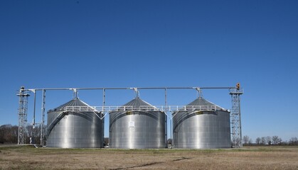 grain silos in the field, lower third © bybarn