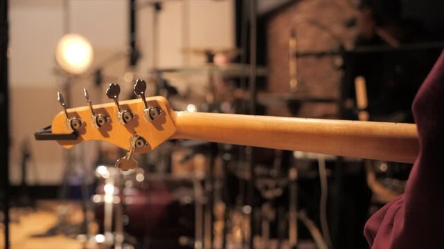 Close-up of guitar neck in recording studio