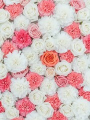 Vibrant floral wall with roses and carnations