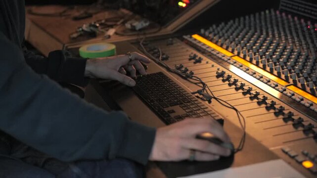 Sound engineer working in music studio