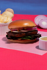 Minimalist Concept: Perfect Beef Burger Isolated on Pink